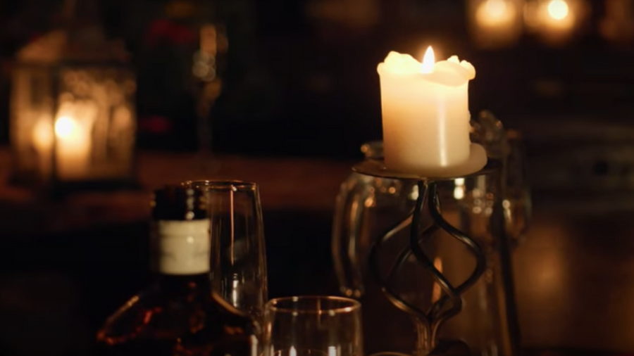 A candlelit table setting ready for a dumb supper during Edinburgh Halloween celebrations.